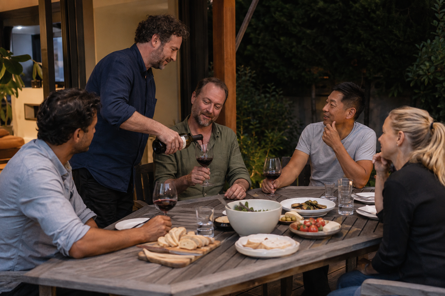 Adults drinking socially with friends at dinner